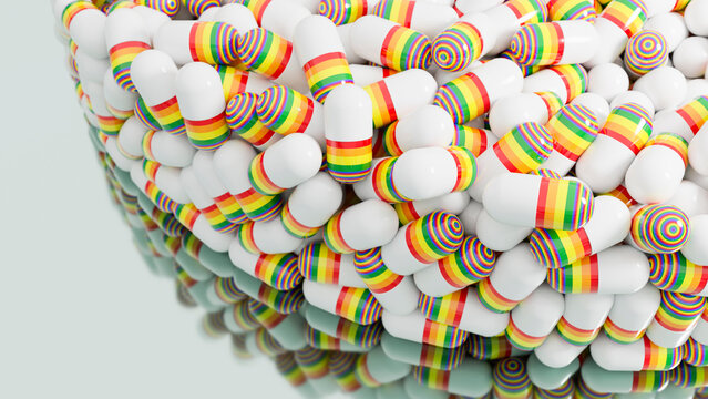 White capsules with rainbow stripes piled close-up
