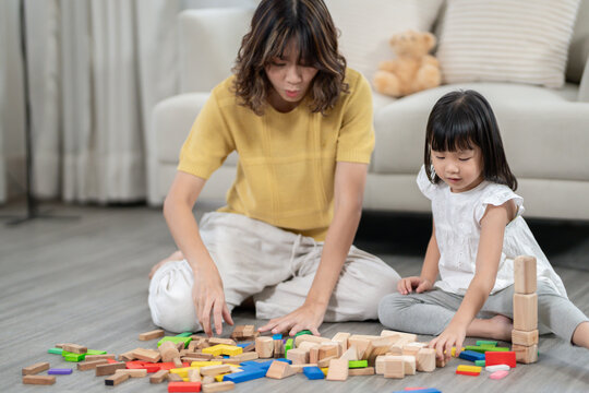 Happy Asian child playing and learning toy blocks. children are very happy and excited at home. child have a great time playing, activities, development, attention deficit hyperactivity disorder