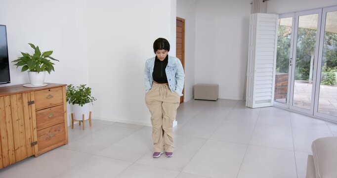 High speed photography for dynamic scenes, posing confidently, woman in casual outfit standing in mo