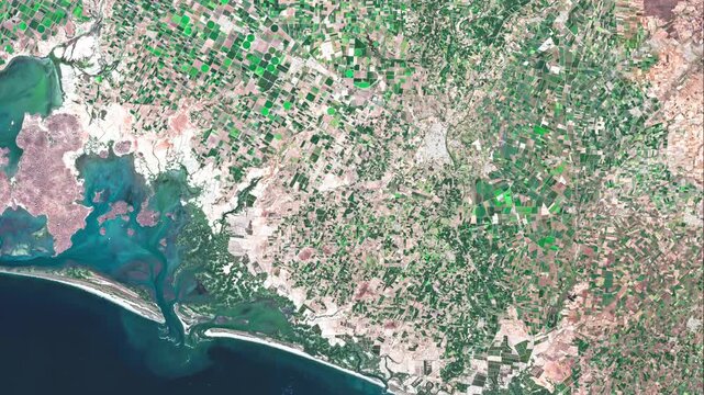 Scenic aerial footage of the Sinaloa coastline in Mexico, featuring green agricultural fields, rural landscapes and the Pacific Ocean