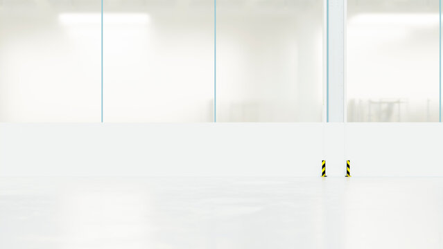 Empty car manufacturing factory floor with large windows and guards
