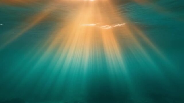 Underwater sunbeams piercing turquoise water with shimmering light effect