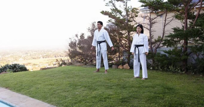 Lifestyle videos outdoor of people doing activities, Practicing martial arts, man and woman in karat