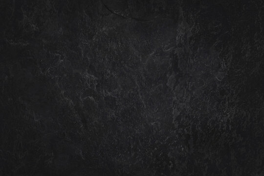 Dark grey black slate texture in natural pattern with high resolution for background and design art work. Black stone wall.