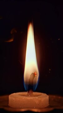 Single Candle Flame Burning in Darkness for Kali Puja and Diwali