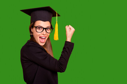 Portrait of cute delighted funny funky teen teenager raise fists winner yes yeah scream shout eyewear eyeglasses black jacket fashionable tails isolated pigtail yellow background
