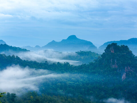 Sunrise mountain fog landscape Scenic view dramatic beautiful sky. Romantic landscape sunset foggy green mountain valley. Beautiful foggy hills sun light time. Morning nature golden dawn sky scenery