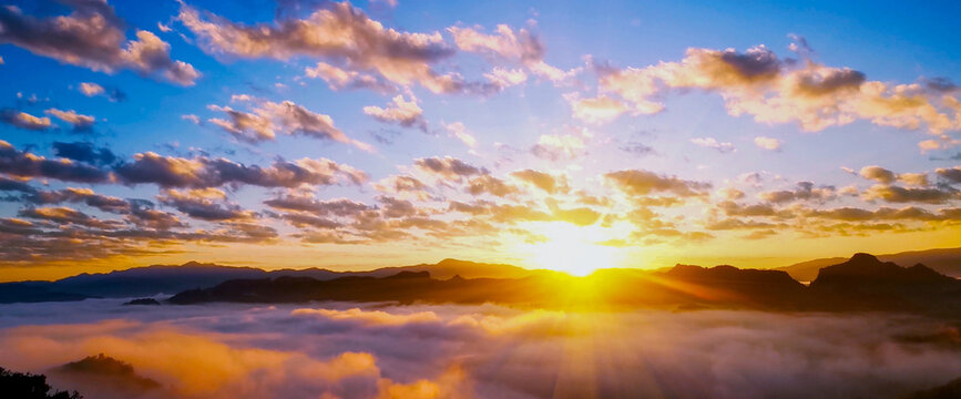 Banner Dramatic sunset mountain landscape. Banner foggy hills sun light time. panoramic Majestic green scenery big mountain hill cloudscape valley panorama view greenery country. Scenic beautiful