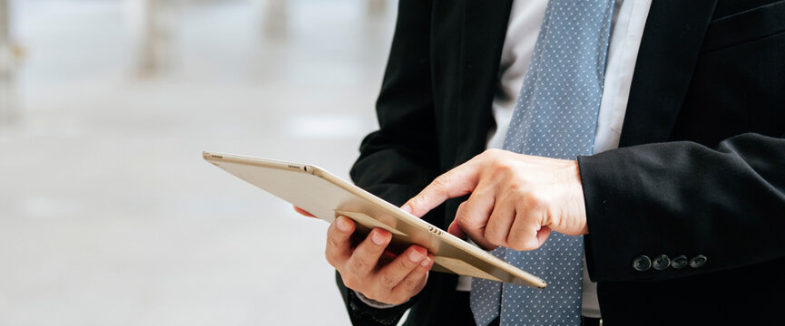 Banner man hand using digital tablet smartphone. Hands holding smart digital tablet touch screen shopping online call text message. Banner man hand using smartphone internet of things with copy space