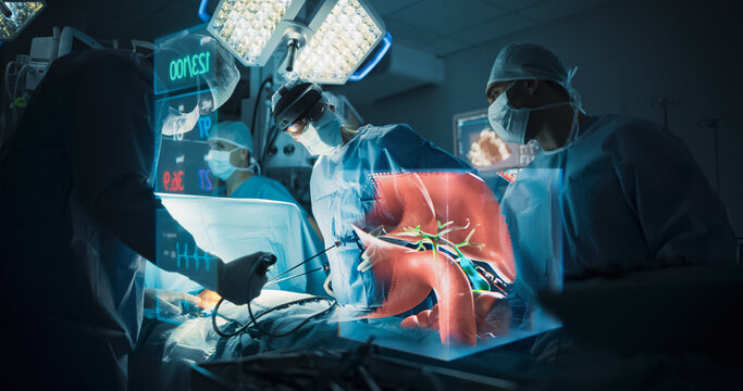 Futuristic Hospital Operating Room Surgery Using Holographic Augmented Reality. Surgeon in an Ar Headset Guides Laparoscopic Tools as a Floating Liver Hologram and Vital Signs Assist the Treatment.