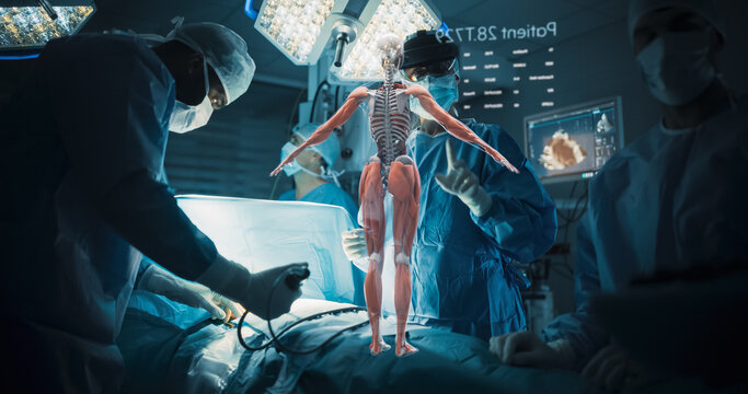 Futuristic Hospital Operating Room Surgery Using Holographic Augmented Reality. Surgeon in an Ar Headset Turns a Floating Muscle and Bone Hologram With Hand Gestures as the Team Treats the Patient.