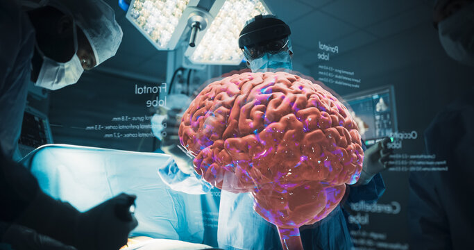 Futuristic Hospital Operating Room Surgery Using Holographic Augmented Reality. Surgeon in Headset Inspects Brain Hologram With Labeled Lobes Floating Above the Operating Table During Treatment.