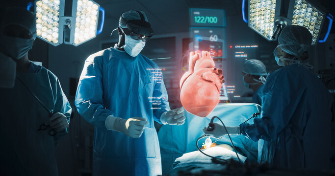 Futuristic Hospital Operating Room Surgery Using Holographic Augmented Reality. Surgeon in an Ar Headset Manipulates a Floating Hologram of a Human Heart to Treat Valve Disease and Heart Failure.
