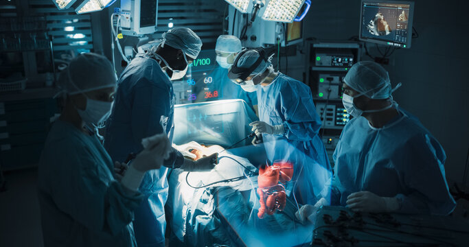 Futuristic Hospital Operating Room Surgery Using Holographic Augmented Reality. Surgeon in an Ar Headset Guides Keyhole Instruments Through a Glowing Hologram of the Intestine During Bowel Treatment.