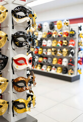 Naklejka premium Masquerade and carnival celebration, venetian masks on display in a retail store for party supplies and festive events with diverse colorful designs