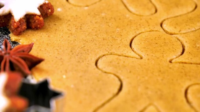 baking christmas gingerbread cookies with dough man cutter star anise and festive spices