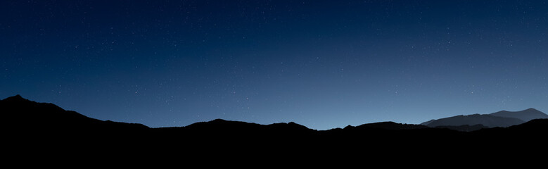 Glowing Christmas star above a peaceful mountain landscape © vovan