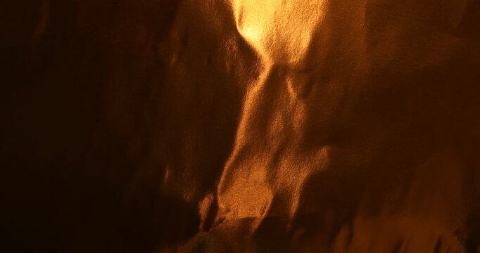 Dark copper metallic foil background with warm golden reflections