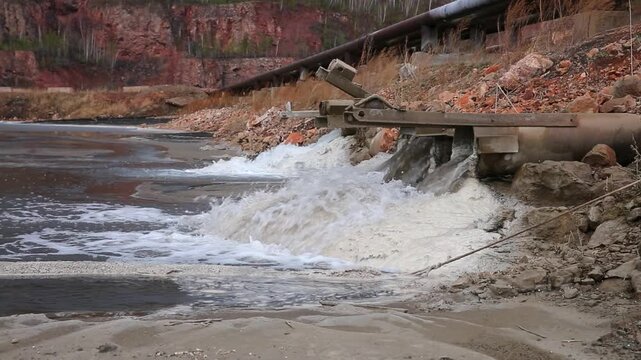 The discharge of toxic waste into the river, environmental pollution of nature.