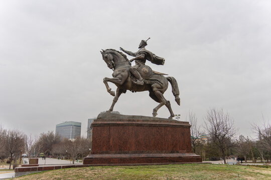 Amir Timur statue in the center of Tashkent, overcast day, bare trees.