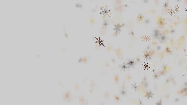 Minimalist winter background with golden snowflakes falling slowly