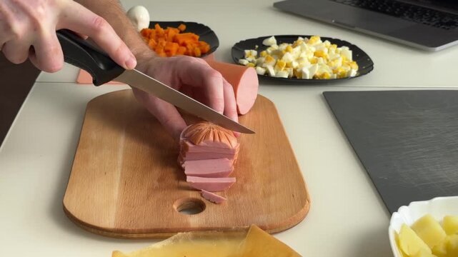 Top-down kitchen action where hands remove papery ham casing and cut even slices, showing cylindrical meat, sharp knife work, and nearby eggs plus chopped vegetables on wooden board