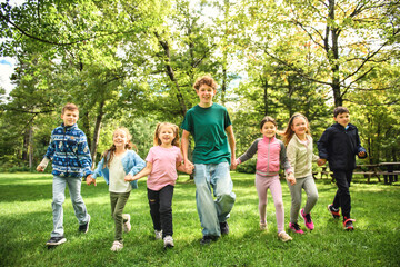 Fototapeta premium Cheerful camp kids having fun at summer camp