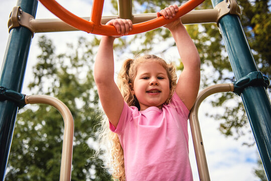 Little girl on on a playground having fun