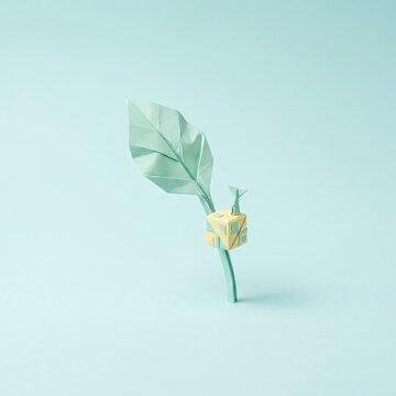 Unique Origami Leaf and Box Sculpture Against Soft Blue Background for Modern Creative Projects
