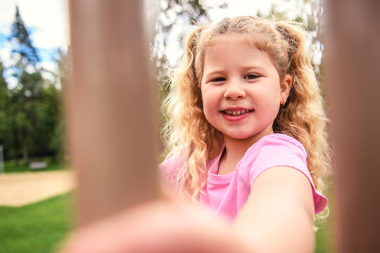 Little girl on on a playground having fun