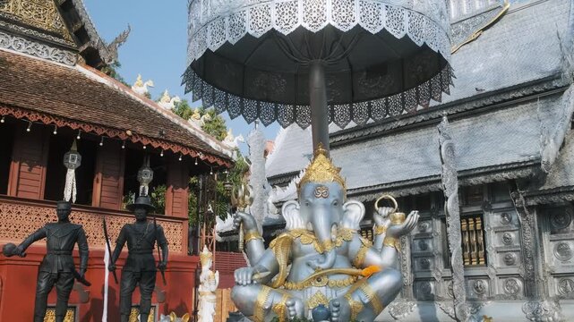 Silver Ganesha statue displayed in courtyard of Wat Sri Suphan Silver Temple in Chiang Mai, Thailand. Hindu deity, Southeast Asian religious culture, Thai architecture and cultural tourism