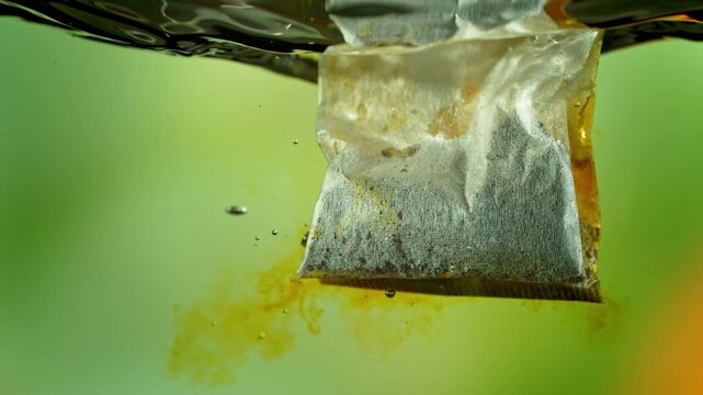 Super Slow Motion of Falling and Extracting Tea Bag in Hot Water at 1000fps.