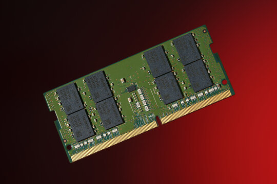 SO-DIMM DDR5 RAM module for laptop upgrades, isolated on a red background.