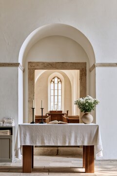 Church interior arch and nave with stained glass window and stone architecture framed by altar flowers for design, card, poster, background
