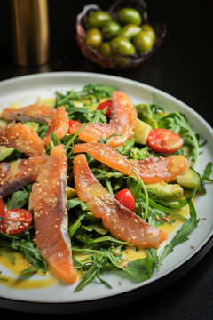 Salad with salted salmon and arugula