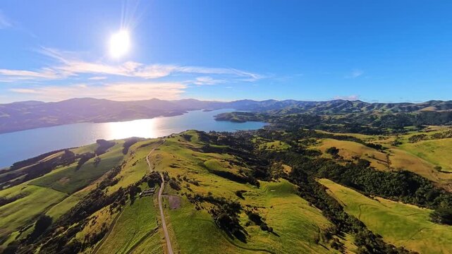 Aerial view of New Zealand, green hillside farms under the blue sky, Akaroa