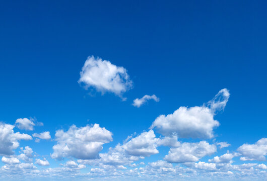 blue sky background with tiny clouds