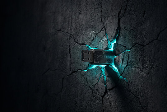 USB drive embedded in a cracked glowing concrete wall