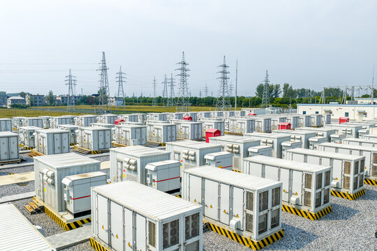 rows of white battery energy storage containers in outdoor power station
