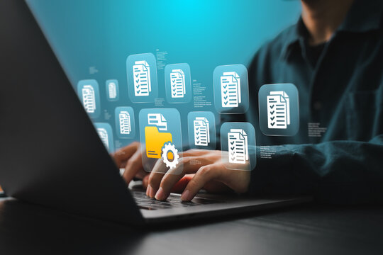 A businessman is organizing digital documents for cloud storage using document folder-based database technology.