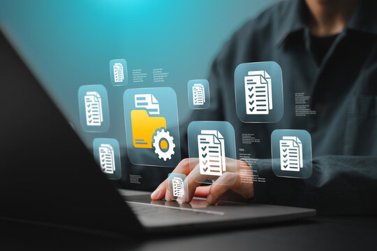 A businessman is organizing digital documents for cloud storage using document folder-based database technology.