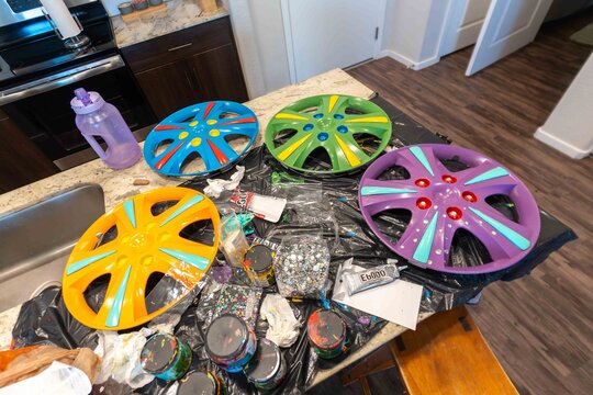 Colorful wheel rims on kitchen counter