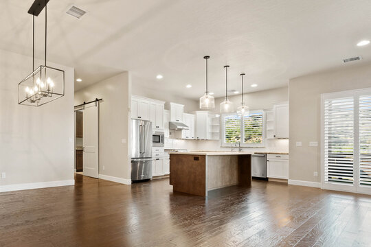 Bright contemporary kitchen with island and white cabinets