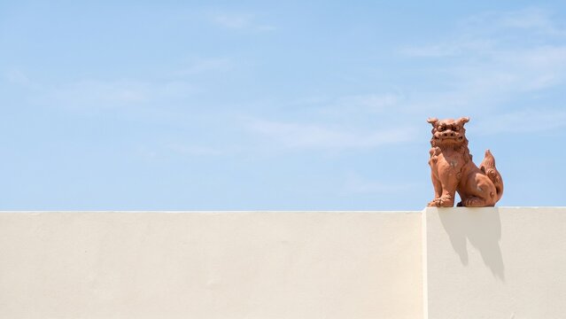 Okinawan shisa statues on a wall