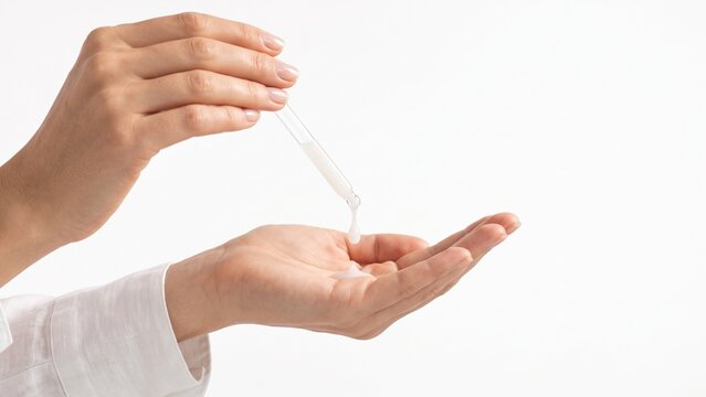 Applying cosmetic serum to hand