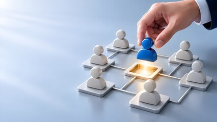 Obraz premium Hand placing a blue leader figure into a glowing network center among white employee icons representing team management and human resources selection