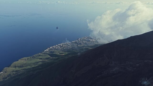 Aerial view of Stromboli volcano and coastline in Italy.