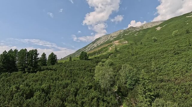 lomnicky stit peak upper station cable car cabin ascent high tatras carpathians mountain landscape green valley hiking trail slovakia scenic alpine nature summer clouds concept of travel tourism