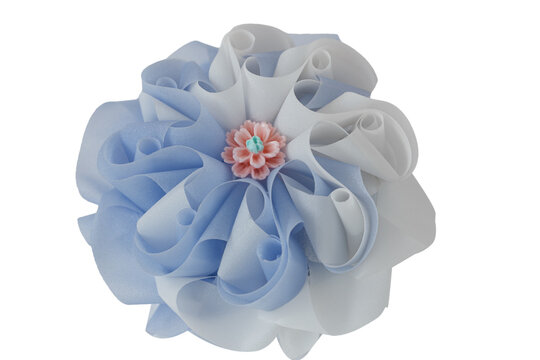 Handmade craft Thai festival decoration,Coins wrapped in floral ribbons on  a white background.