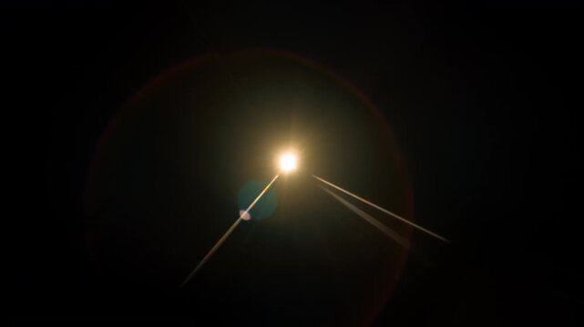 Real Lens Flare Overlay in Motion Isolated on Black Background at 1000fps Slow Motion.